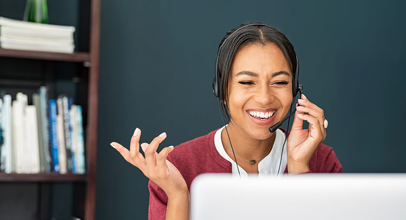 Customer service representative assisting clients over the phone late at night